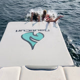 Slip and slide inflatable swim pad dock mat