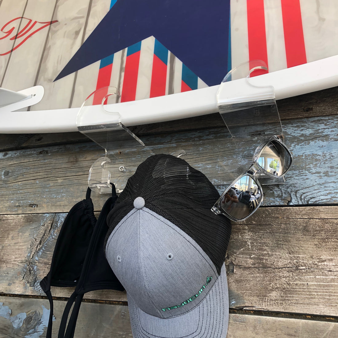 Wakesurf board rack by NautiCurl. Hang your wakeboard, wakesurfer or skateboard in style with clear acrylic racks